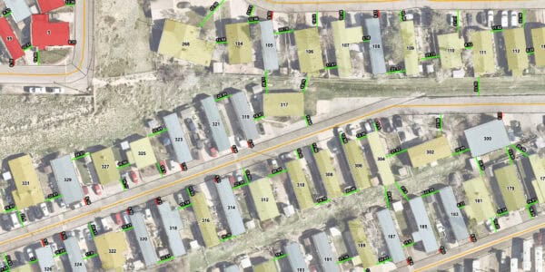 Mobile-home lots — numbered and measured parcels outlined along a narrow road, with parked cars and grassy strips visible in a suburban aerial mapping view.

Text found (legible labels seen):
5, 95, 12.36, 12.51, 6.35, 19.99, 268, 104, 105, 106, 107, 108, 109, 110, 111, 112, 23.16, 24.78, 13.94, 12.96, 9.92, 18.62, 10.24, 8.31, 5.16, 17.41, 23.97, 23.72, 8.12, 15.82, 22.56, 8.28, 317, 319, 321, 323, 325, 327, 329, 331, 20.99, 14.03, 28.70, 19.79, 6.84, 25.09, 24.51, 16.96, 16.47, 8.04, 6.88, 6.54, 314, 316, 312, 310, 308, 306, 304, 302, 300, 320, 318, 322, 324, 326, 21.39, 26.55, 19.99, 20.06, 19.78, 27.02, 22.99, 27.86, 22.59, 6.31, 15.34, 14.97, 18.29, 15.6, 20.82, 193, 191, 189, 187, 185, 183, 181, 179.

(If you need a fully itemized map overlay or CSV of every measurement text position, I can extract and deliver that.)