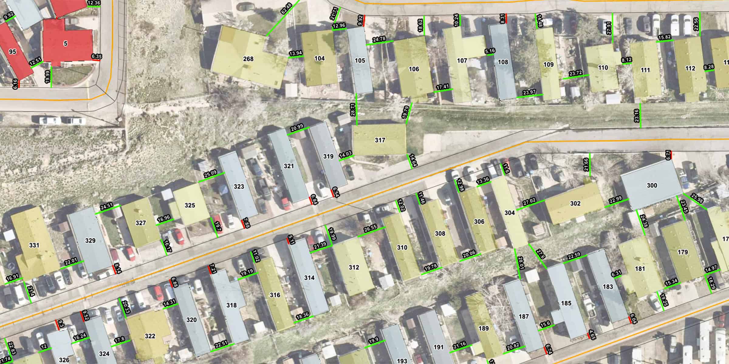 Mobile-home lots — numbered and measured parcels outlined along a narrow road, with parked cars and grassy strips visible in a suburban aerial mapping view.

Text found (legible labels seen):
5, 95, 12.36, 12.51, 6.35, 19.99, 268, 104, 105, 106, 107, 108, 109, 110, 111, 112, 23.16, 24.78, 13.94, 12.96, 9.92, 18.62, 10.24, 8.31, 5.16, 17.41, 23.97, 23.72, 8.12, 15.82, 22.56, 8.28, 317, 319, 321, 323, 325, 327, 329, 331, 20.99, 14.03, 28.70, 19.79, 6.84, 25.09, 24.51, 16.96, 16.47, 8.04, 6.88, 6.54, 314, 316, 312, 310, 308, 306, 304, 302, 300, 320, 318, 322, 324, 326, 21.39, 26.55, 19.99, 20.06, 19.78, 27.02, 22.99, 27.86, 22.59, 6.31, 15.34, 14.97, 18.29, 15.6, 20.82, 193, 191, 189, 187, 185, 183, 181, 179.

(If you need a fully itemized map overlay or CSV of every measurement text position, I can extract and deliver that.)