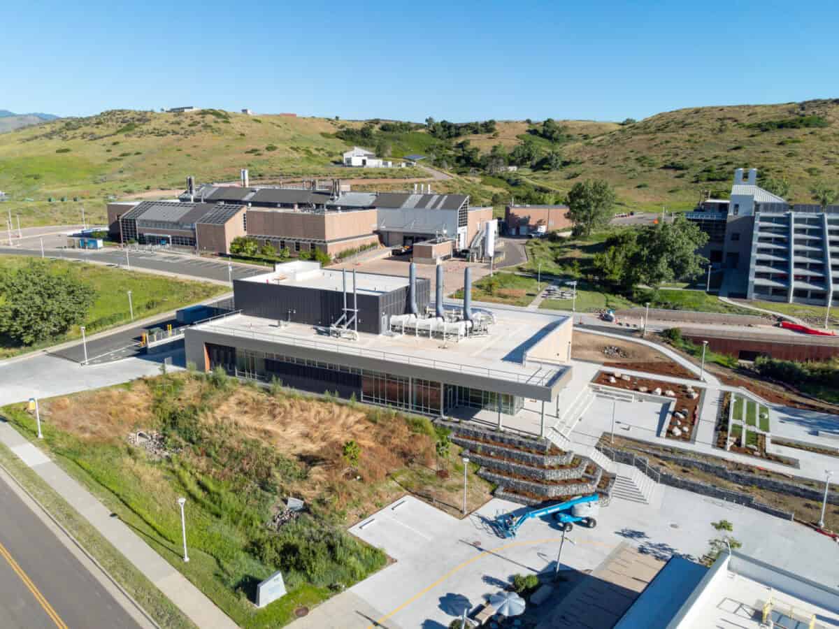 July 16, 2023 - The Research and Innovation Laboratory (RAIL), on the National Renewable Energy Laboratory’s (NREL’s) South Table Mountain (STM) campus, is a flexible, multipurpose lab space to support growing cross-disciplinary research. Aerial view of the RAIL looking northwest with the Field Test Laboratory Building (FTLB) behind it. (Photo by Joshua Bauer and Bryan Bechtold / NREL)