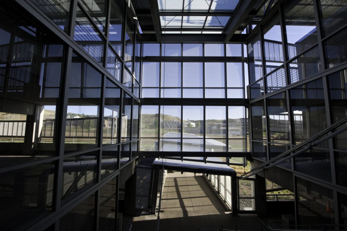 July 24, 2012 - Open atriums provide natural light throughout the parking structure on NREL's  South Table Mountain campus. The common area accesses the campus via foot or small shuttle buses. (Photo by Dennis Schroeder / NREL)