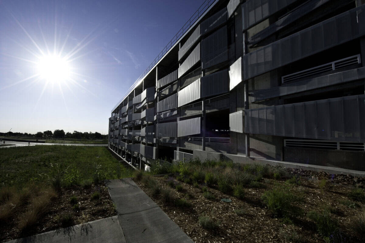 July 24, 2012 - The parking structure on NREL's  South Table Mountain campus has become a central location for employees to begin and end their day, accessing the  campus via foot, bike or small shuttle buses. (Photo by Dennis Schroeder / NREL)