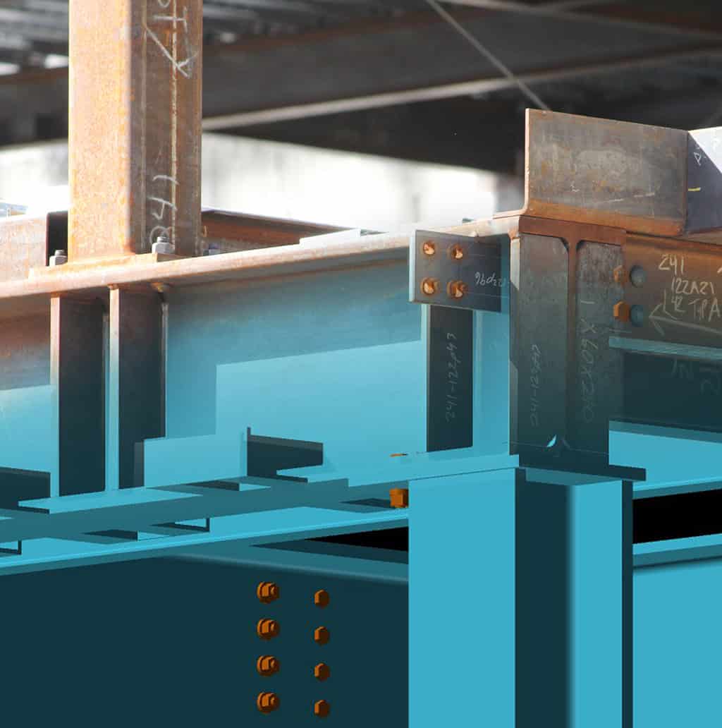 Steel I-beams bolted and welded together, forming a framed support connection beneath an overhead structure at a construction site.

Transcribed handwritten markings (as seen): 
- "241-122943" (on vertical plate)
- "96dz1" (on small bracket)
- "241 (22A2) 42 TPA" (on right beam)